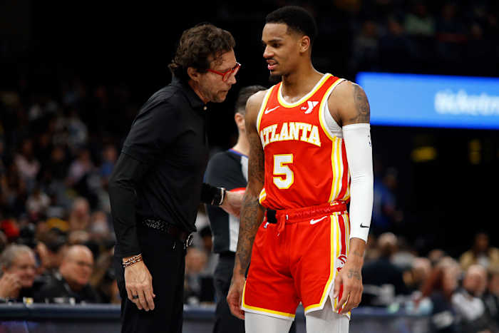 Mar 8, 2024; Memphis, Tennessee, USA; Atlanta Hawks head coach Quin Snyder (left) talks with Atlanta Hawks guard Dejounte Murray (5) during the first half against the Memphis Grizzlies at FedExForum. Mandatory Credit: Petre Thomas-USA TODAY Sports